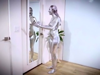 Silver painted milf touching herself in front of a mirror