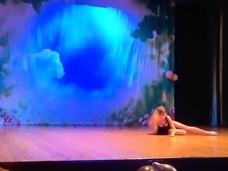 Blonde dancer in a short black dress wiggles her cute booty