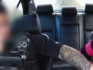 Tattooed babe fucks in police car in public