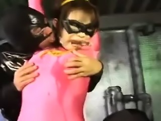 Super heroine is caught by the bad guys and gets groped and