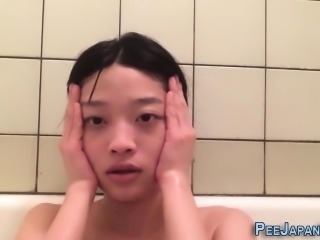 Asian babes pee into cups